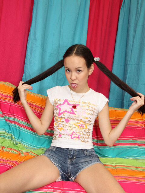 Amai Liu Spreads Her Shaved Pussy In Pigtails And Denim